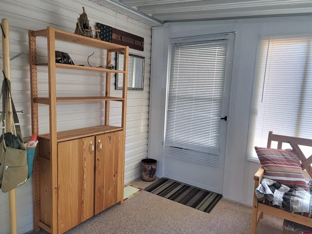a bed room with furniture and a potted plant