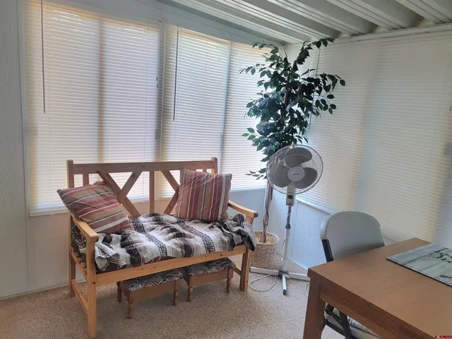 a view of a workspace with furniture