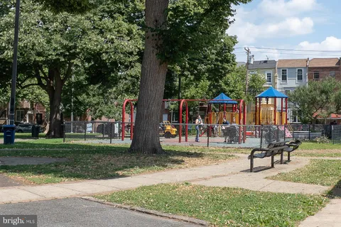 a view of a park with bench and a bench