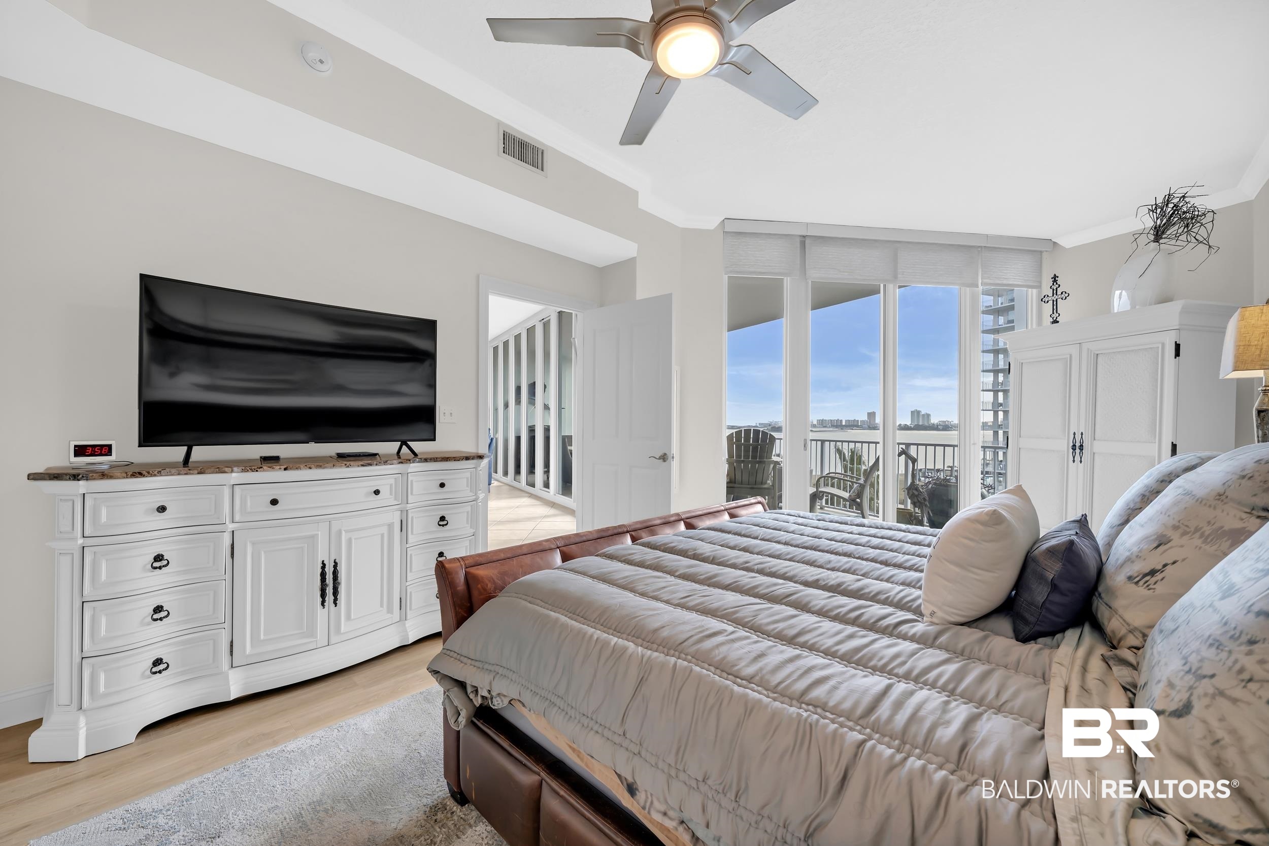 28250 Canal Road, Unit 307 Orange Beach, AL 36561 - Photo 35 of 56 Bedroom with crown molding, light wood-style floors, access to exterior, and ceiling fan