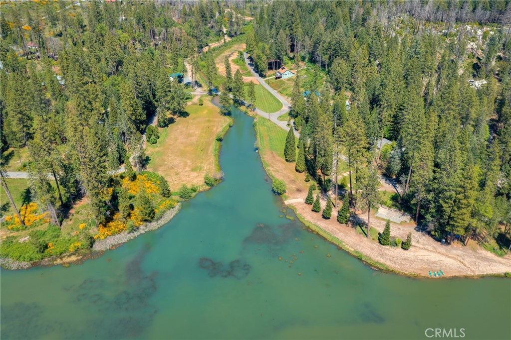 0 Pavlik Pines Road Berry Creek, CA 95916 - Photo 15 of 26 a view of a lake with houses