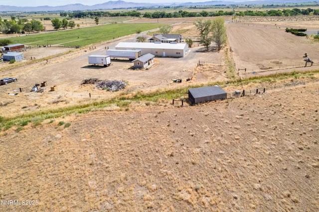 a view of a swimming pool with a yard