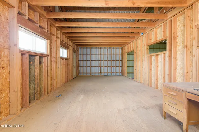 a large bathroom with kitchen island granite countertop a sink and a large mirror