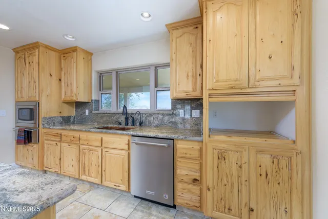 a stove top oven sitting inside of a kitchen