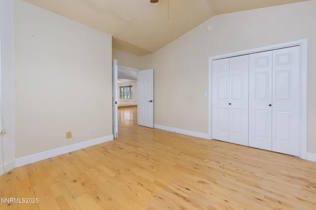 a room with a bed and a window