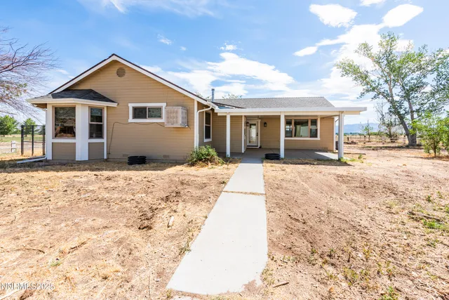 a view of backyard with a patio