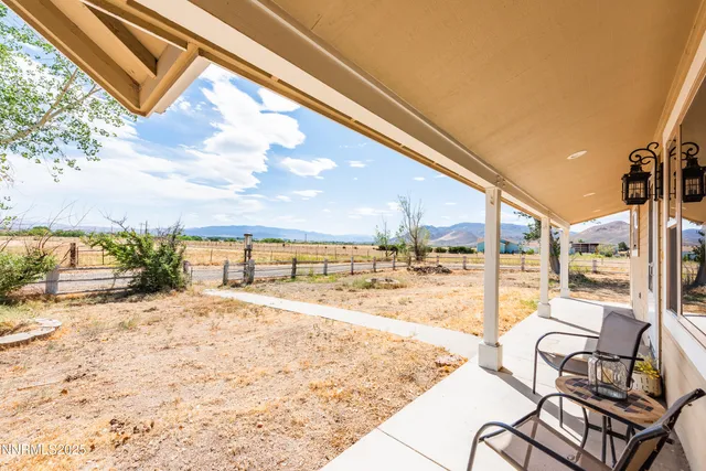 a view of a swimming pool with a yard