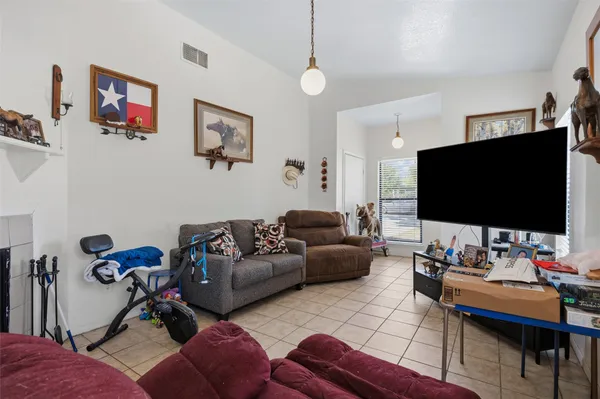 a view of a dining room with furniture and a kitchen