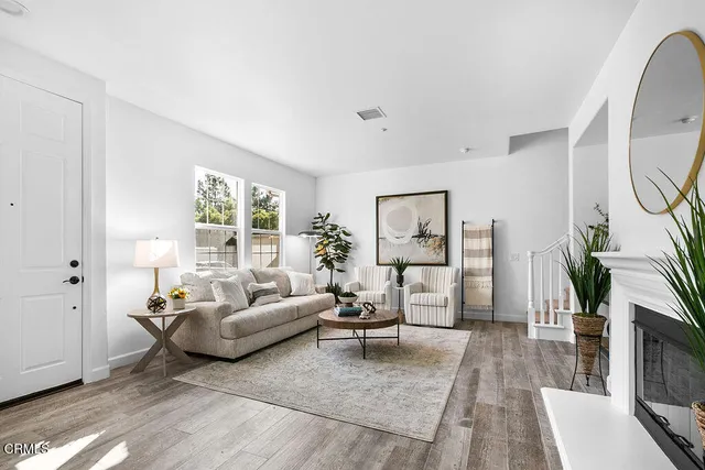 a living room with furniture or couch and a large window