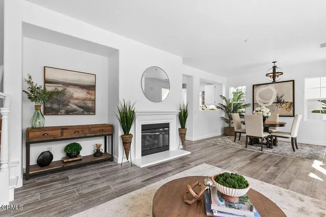 a view of a livingroom with furniture window and wooden floor