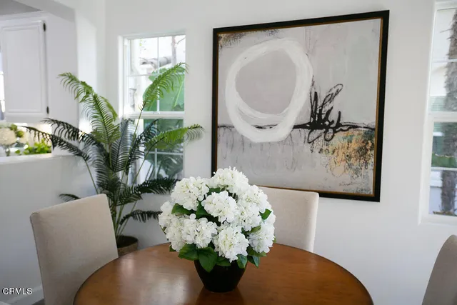 a kitchen with stainless steel appliances a stove a sink and a refrigerator