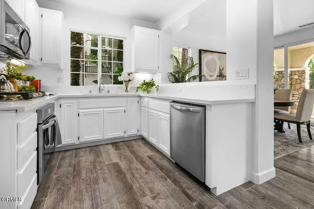 a bathroom with a sink a mirror and shower