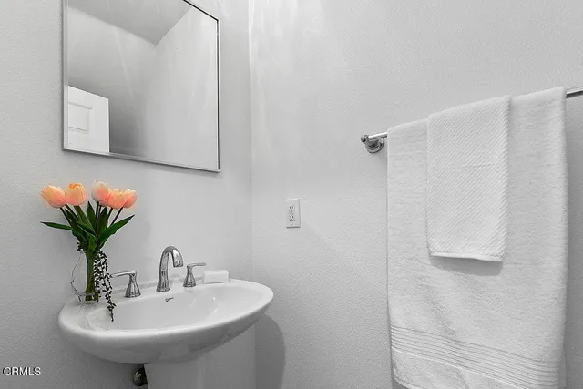 a bed room with a bed and a television