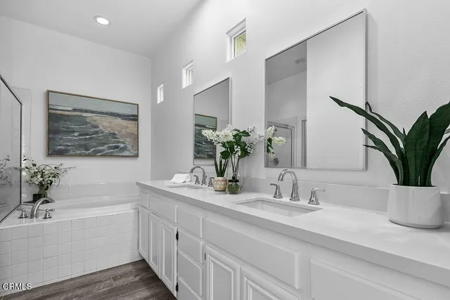 a bathroom with a bathtub and a shower