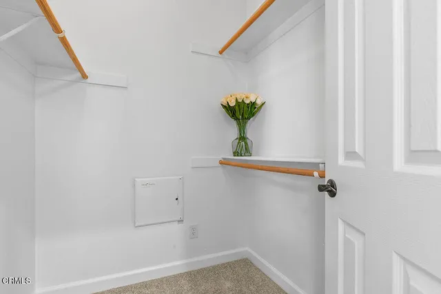 a bed room with a bed and a chair