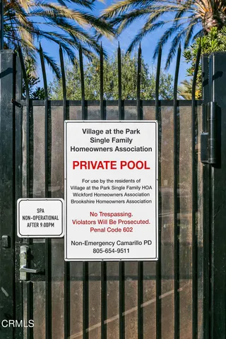 a sign on the side of the tree