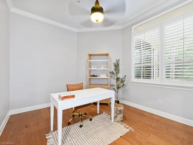 a workspace with furniture and a window