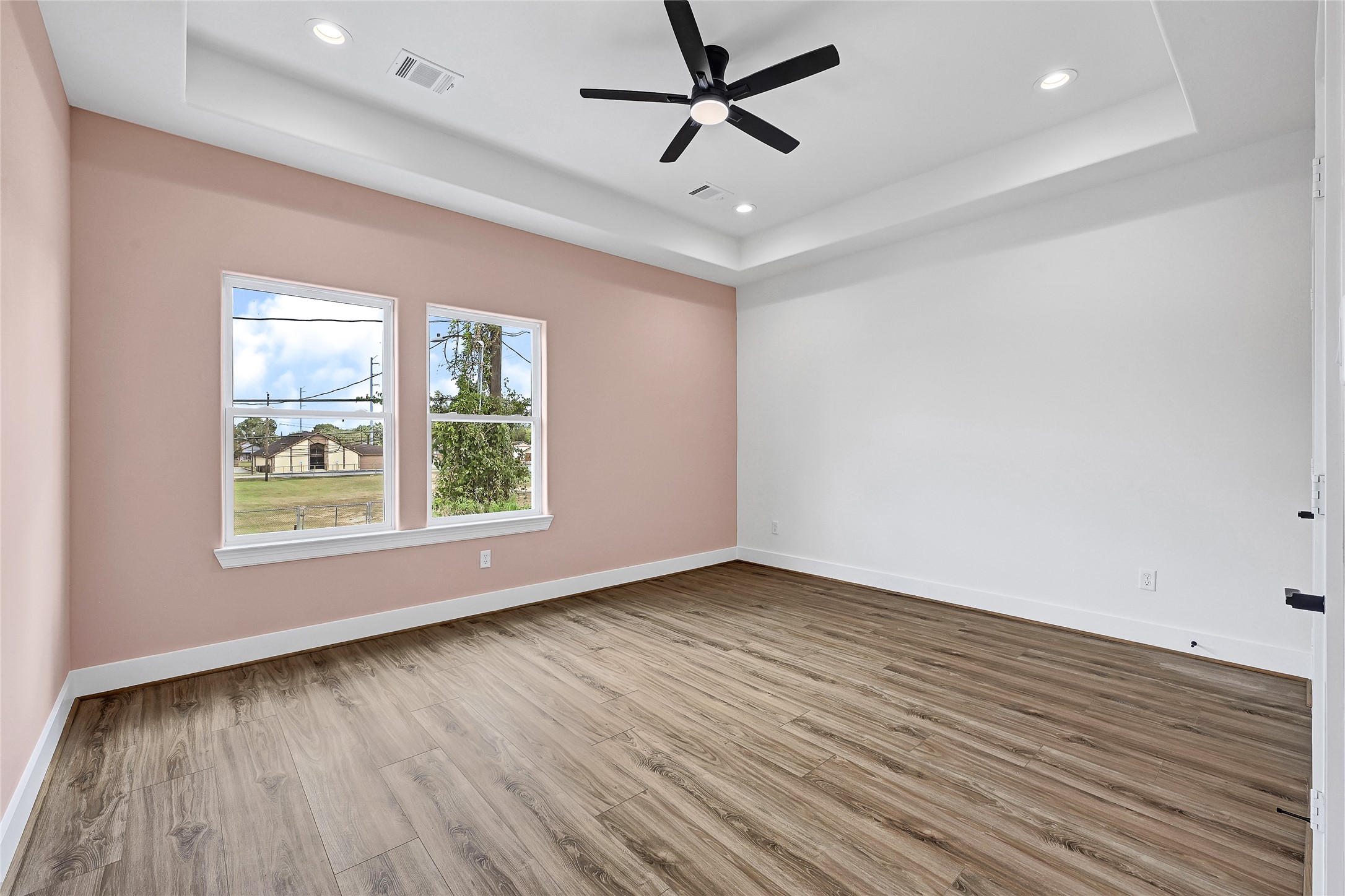 3834 Mt Pleasant Street Houston, TX 77021 - Photo 26 of 50 wooden floor in an empty room with a window