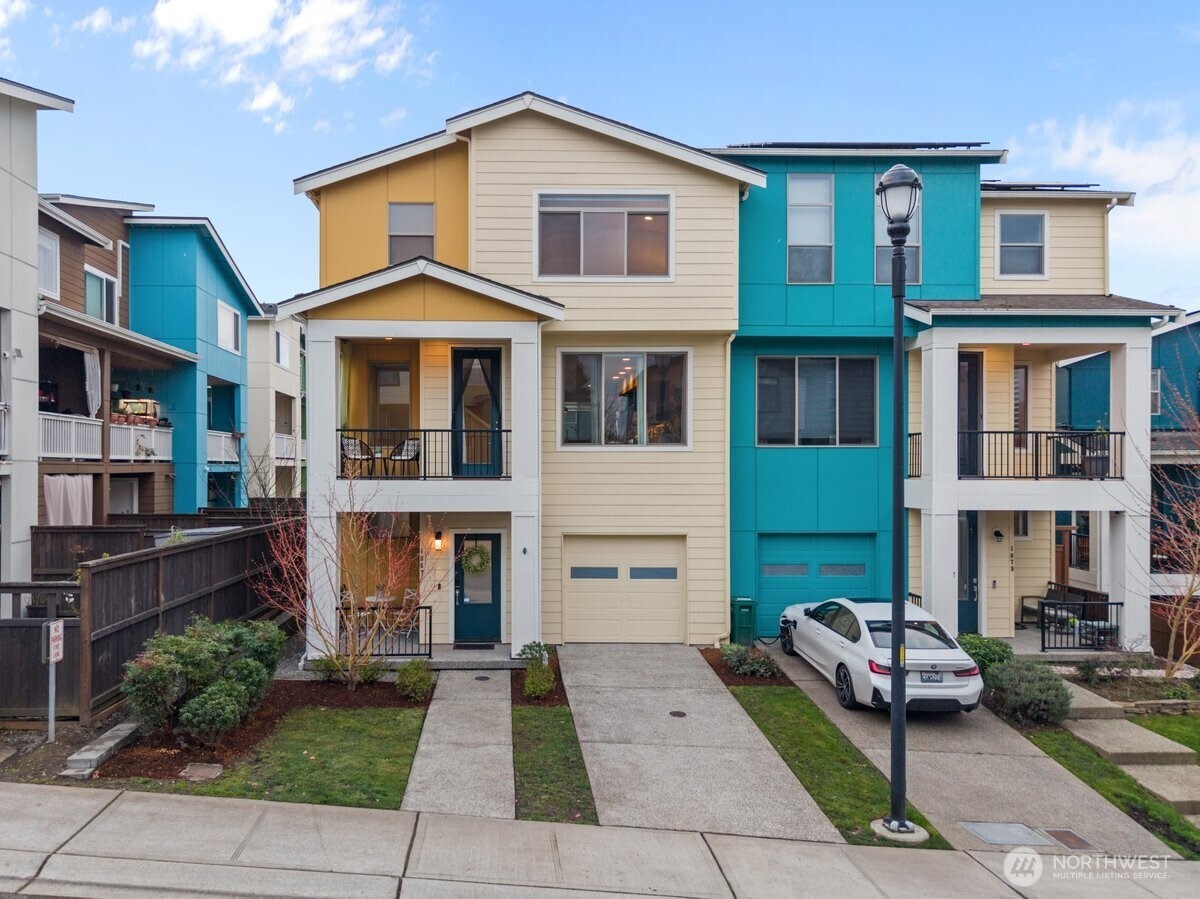 1067 Southwest 97th Street Seattle, WA 98106 - Photo 1 of 1 a front view of a house with a yard