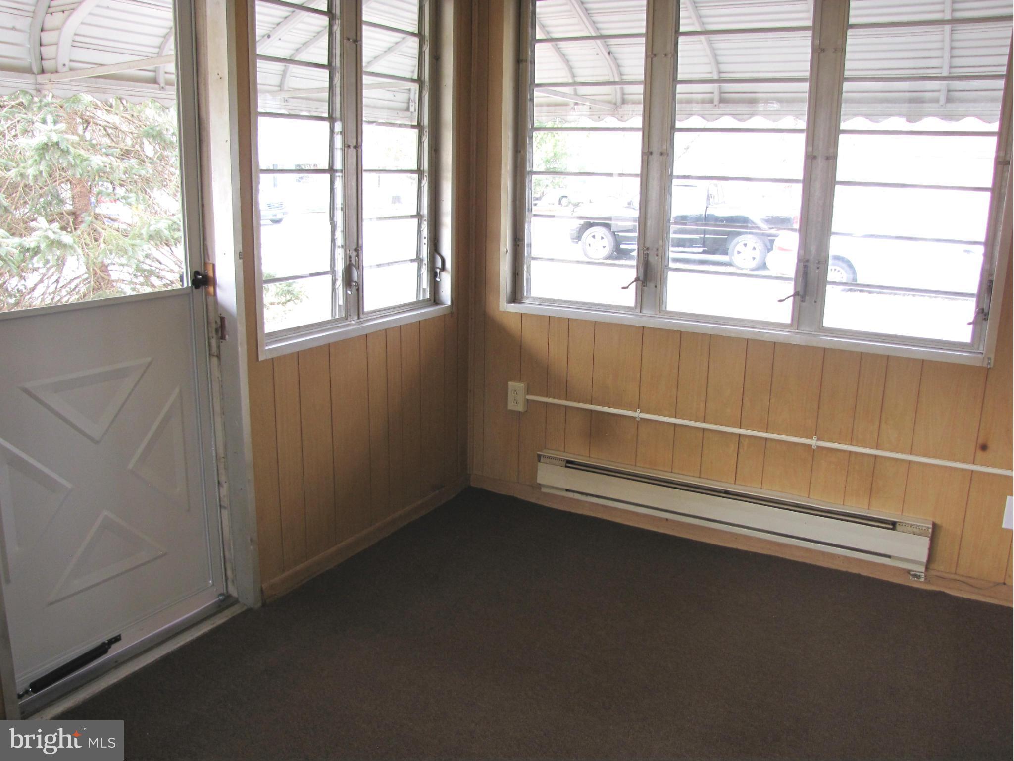 27 Brookfield Road Pasadena, MD 21122 - Photo 15 of 20 an empty room with a window