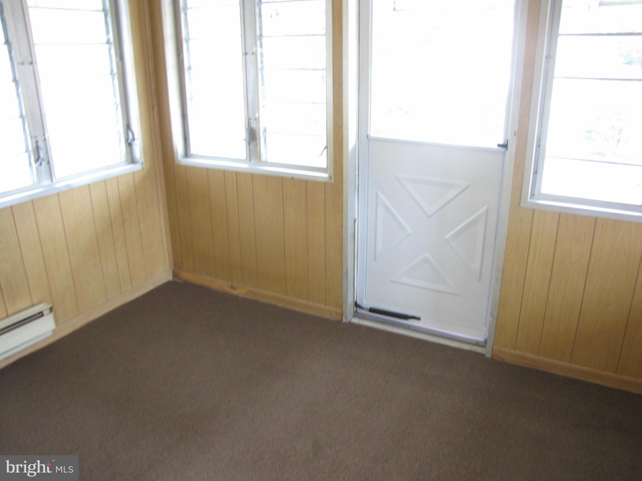 27 Brookfield Road Pasadena, MD 21122 - Photo 16 of 20 an empty room with a window