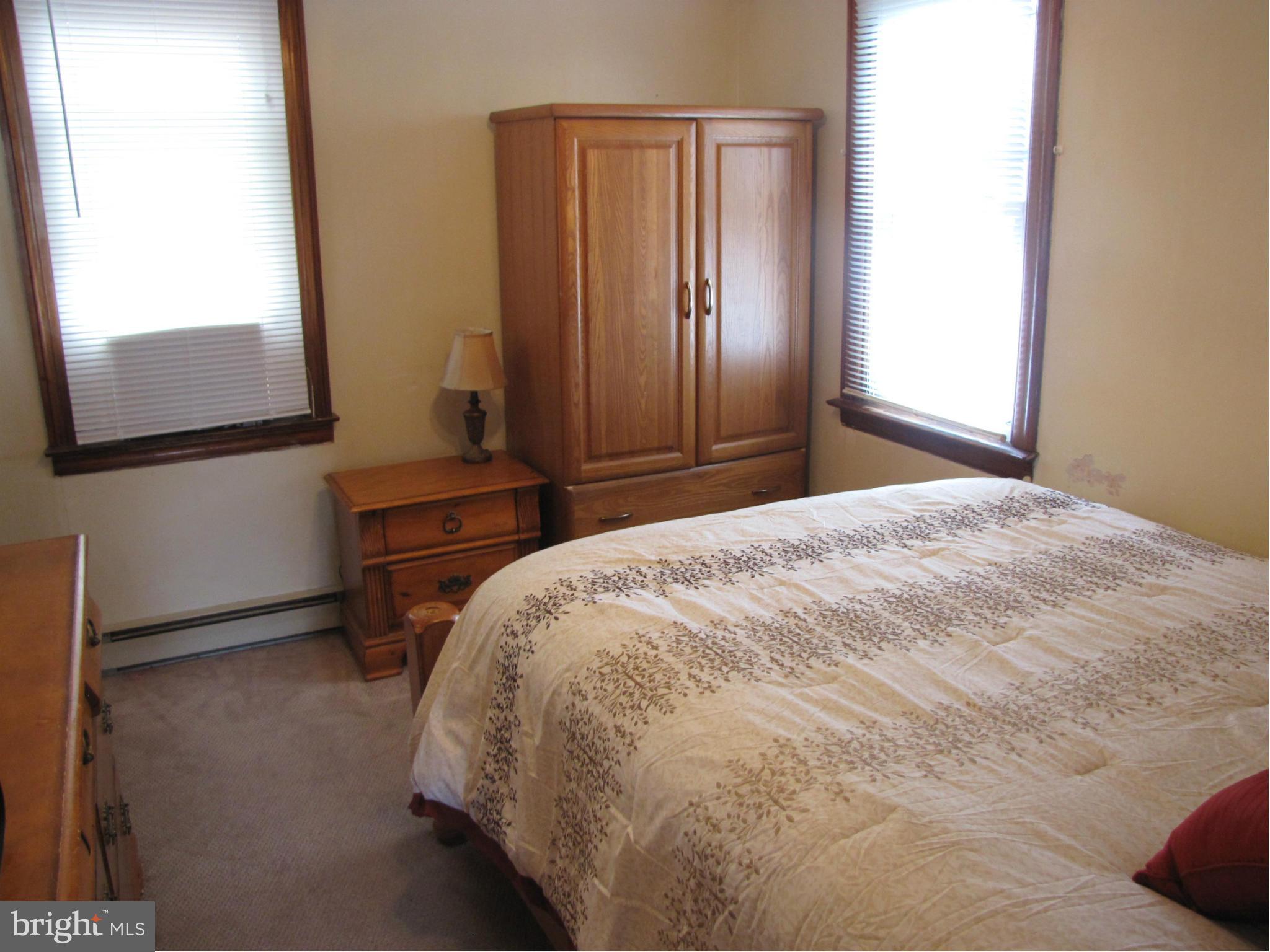 27 Brookfield Road Pasadena, MD 21122 - Photo 10 of 20 a bedroom with a bed and a mirror