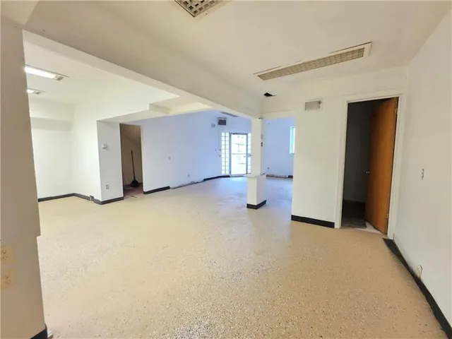 a kitchen with a sink window and cabinets