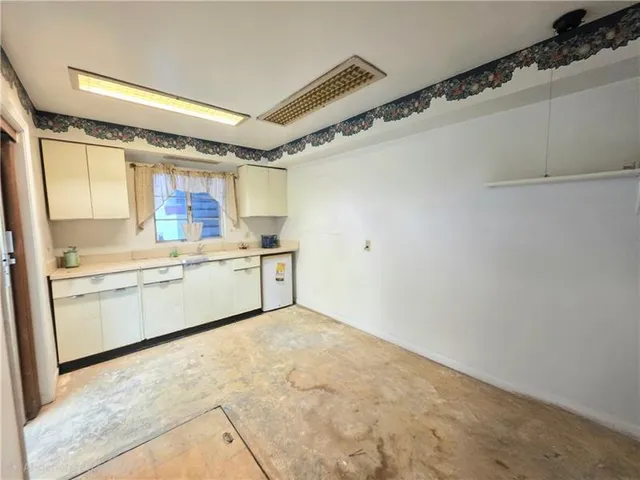 a view of a water heater and a stove