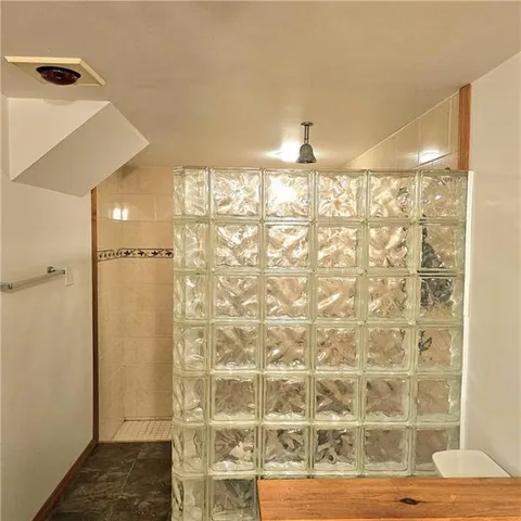 a view of a hall with wooden floor