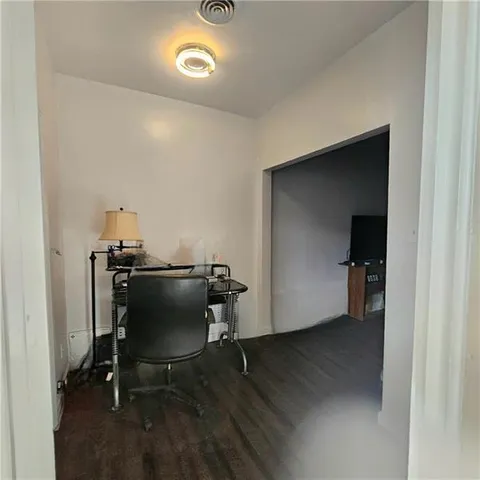 a kitchen with white cabinets