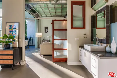 a bathroom with a double vanity sink and a bathtub