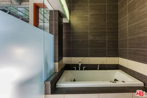 a bathroom with a bath tub