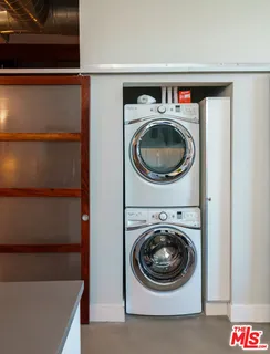 a utility room with washing machine