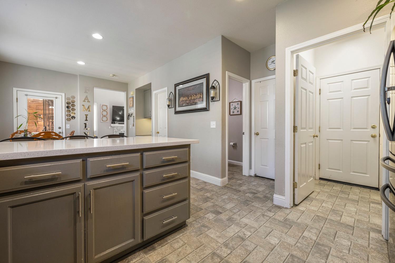 3145 Sweet Pea Avenue Merced, CA 95341 - Photo 15 of 25 a bathroom with a granite countertop sink mirror and cabinets