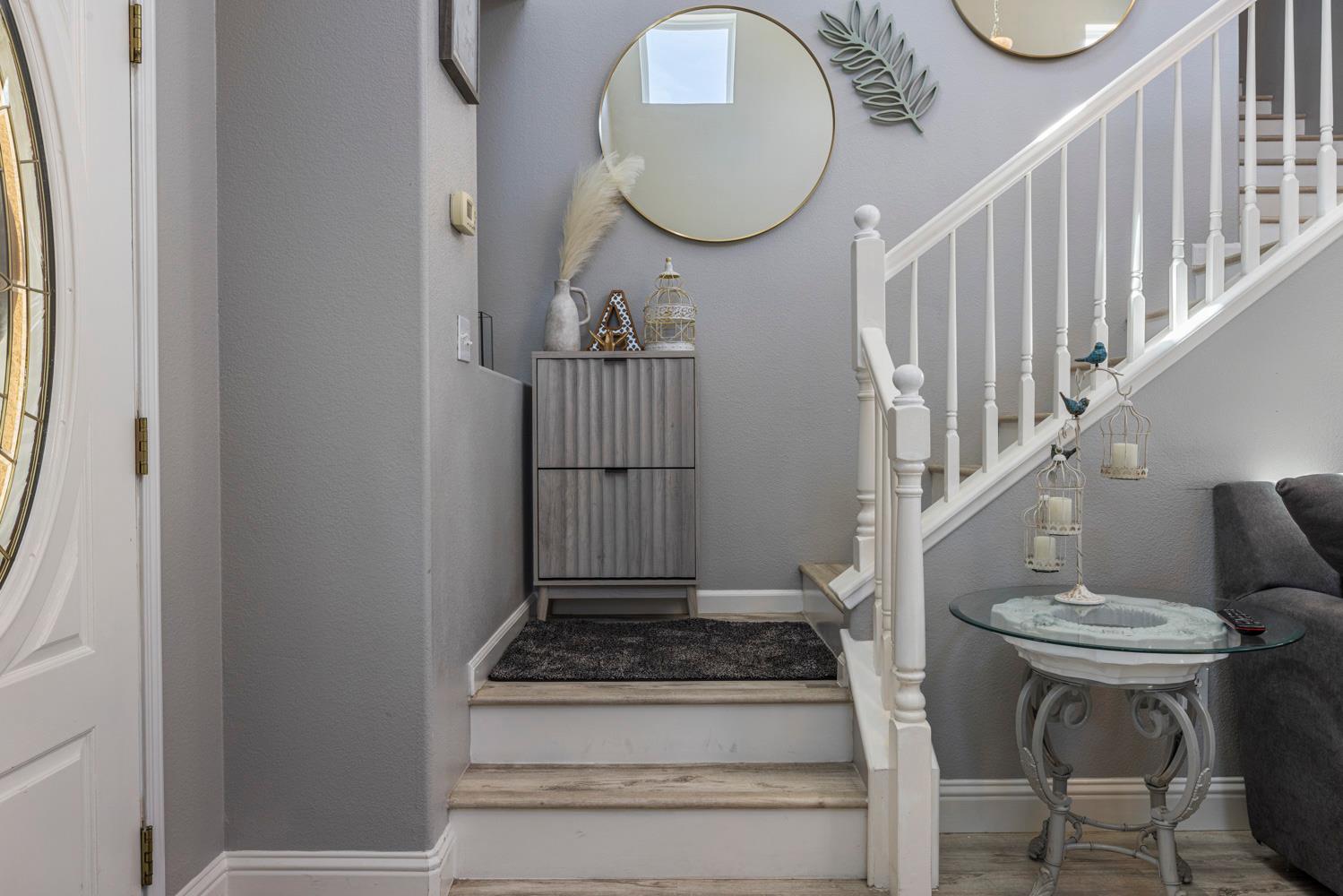 3145 Sweet Pea Avenue Merced, CA 95341 - Photo 8 of 25 a view of entryway and hall with wooden floor