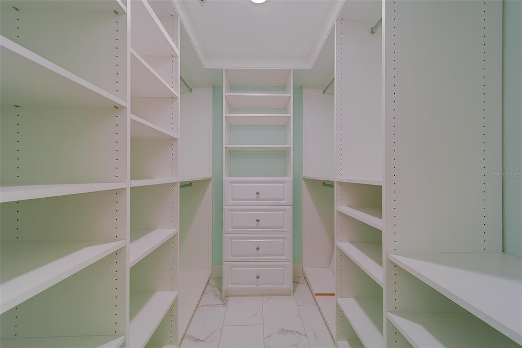 16450 Gulf Boulevard, Unit 565 North Redington Beach, FL 33708 - Photo 27 of 54 a view of walk in closet with empty racks