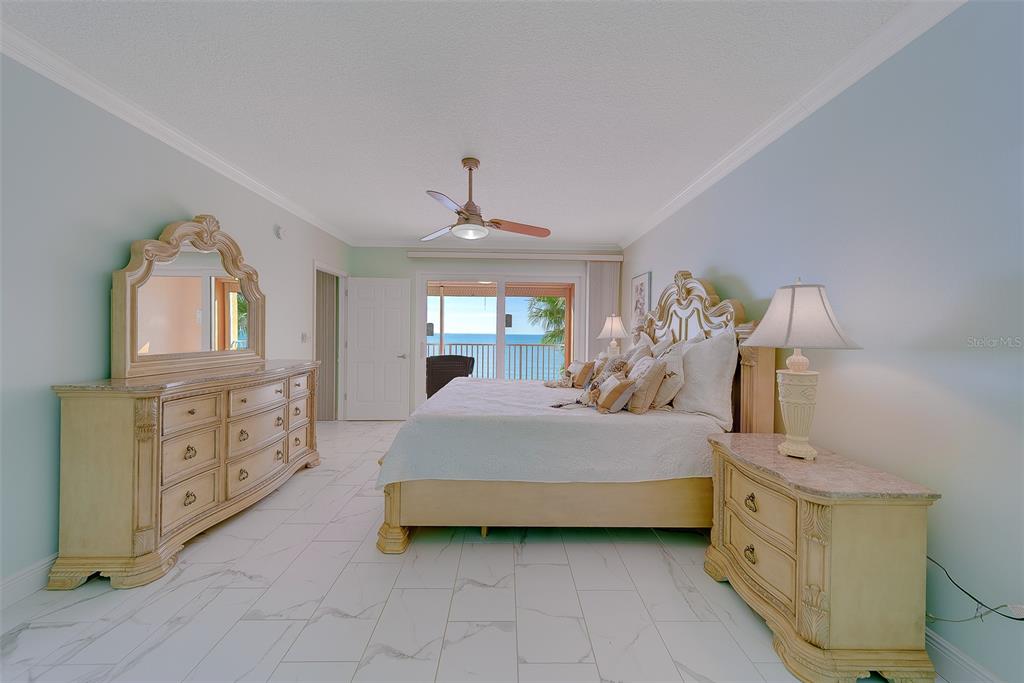 16450 Gulf Boulevard, Unit 565 North Redington Beach, FL 33708 - Photo 28 of 54 a spacious bedroom with a bed and a dresser
