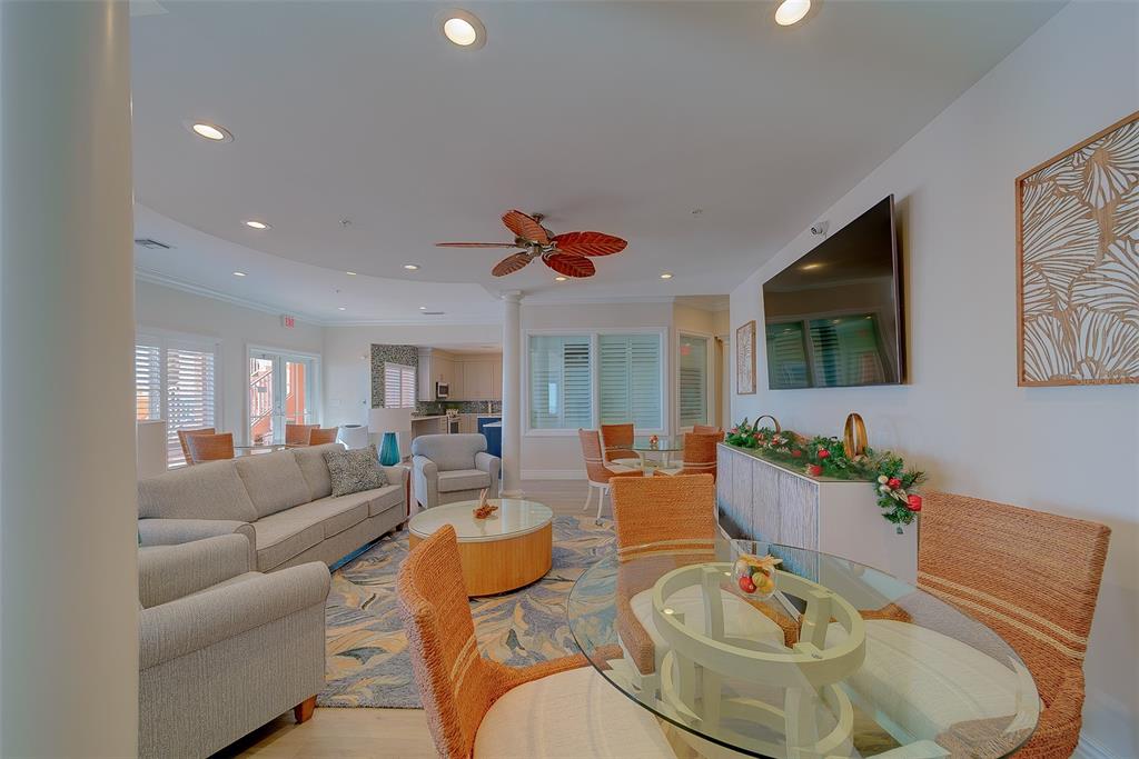 16450 Gulf Boulevard, Unit 565 North Redington Beach, FL 33708 - Photo 36 of 54 a living room with furniture kitchen view and a flat screen tv