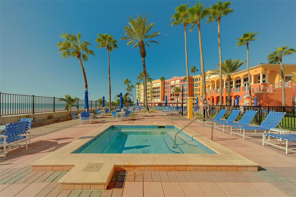 16450 Gulf Boulevard, Unit 565 North Redington Beach, FL 33708 - Photo 39 of 52 a view of a swimming pool with a lounge chairs