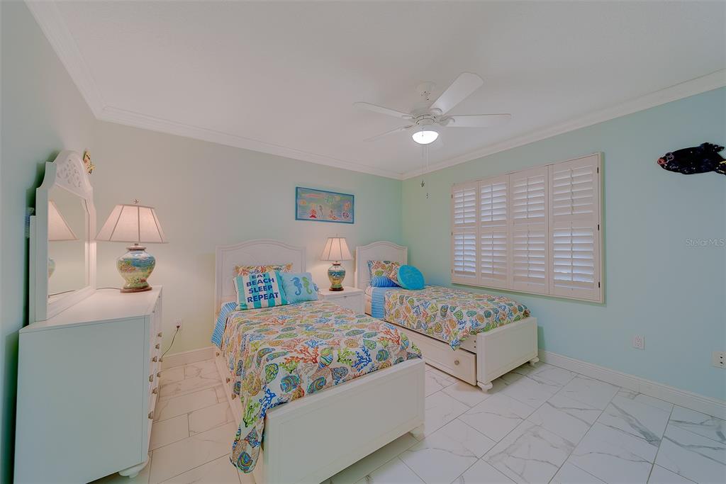 16450 Gulf Boulevard, Unit 565 North Redington Beach, FL 33708 - Photo 47 of 54 a bedroom with bed and window