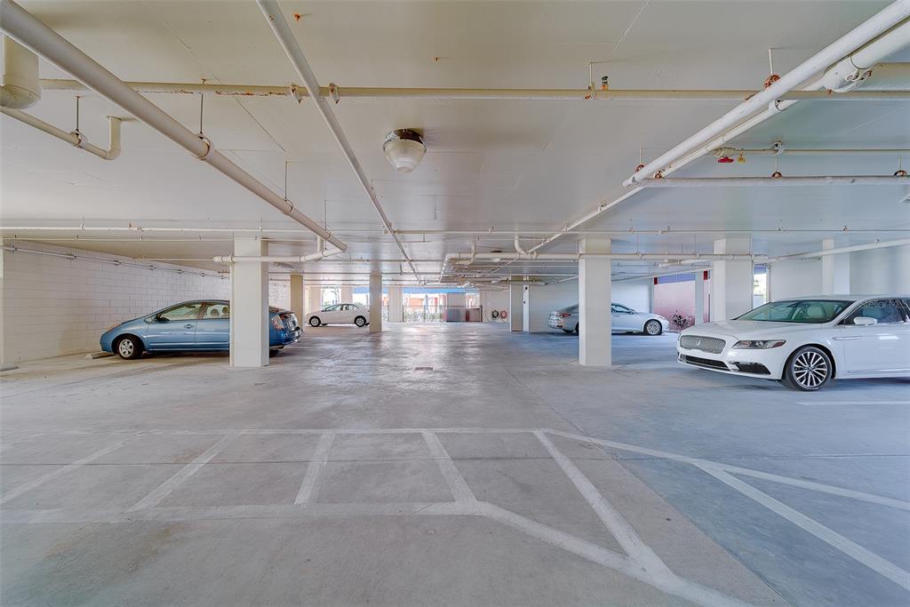 16450 Gulf Boulevard, Unit 565 North Redington Beach, FL 33708 - Photo 50 of 54 a view of parking garage with cars parked