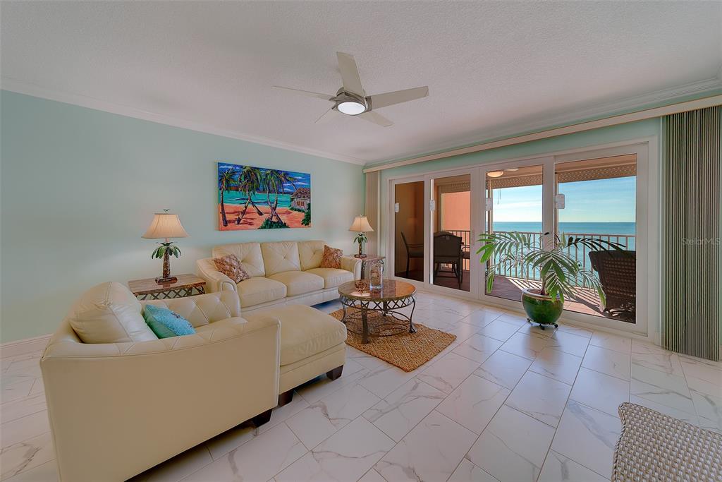 16450 Gulf Boulevard, Unit 565 North Redington Beach, FL 33708 - Photo 10 of 52 a living room with furniture and a large window