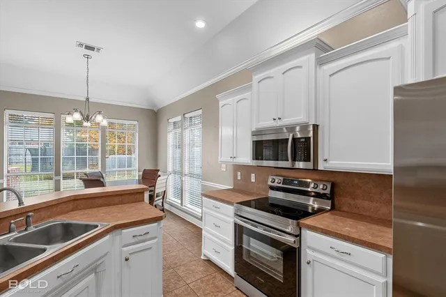 a kitchen with a stove and a sink