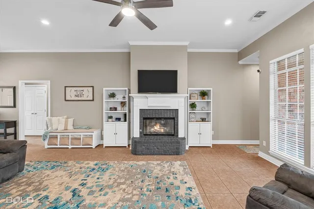 a living room with furniture and a fireplace