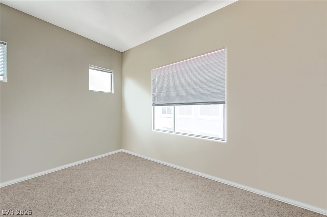 2305 West Horizon Ridge Parkway, Unit 1223 Henderson, NV 89052 - Photo 25 of 28 Empty room with carpet and baseboards