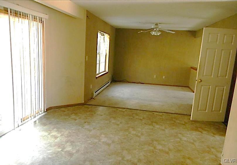 204 Alpine Road Henryville, PA 18332 - Photo 3 of 13 an empty room with windows