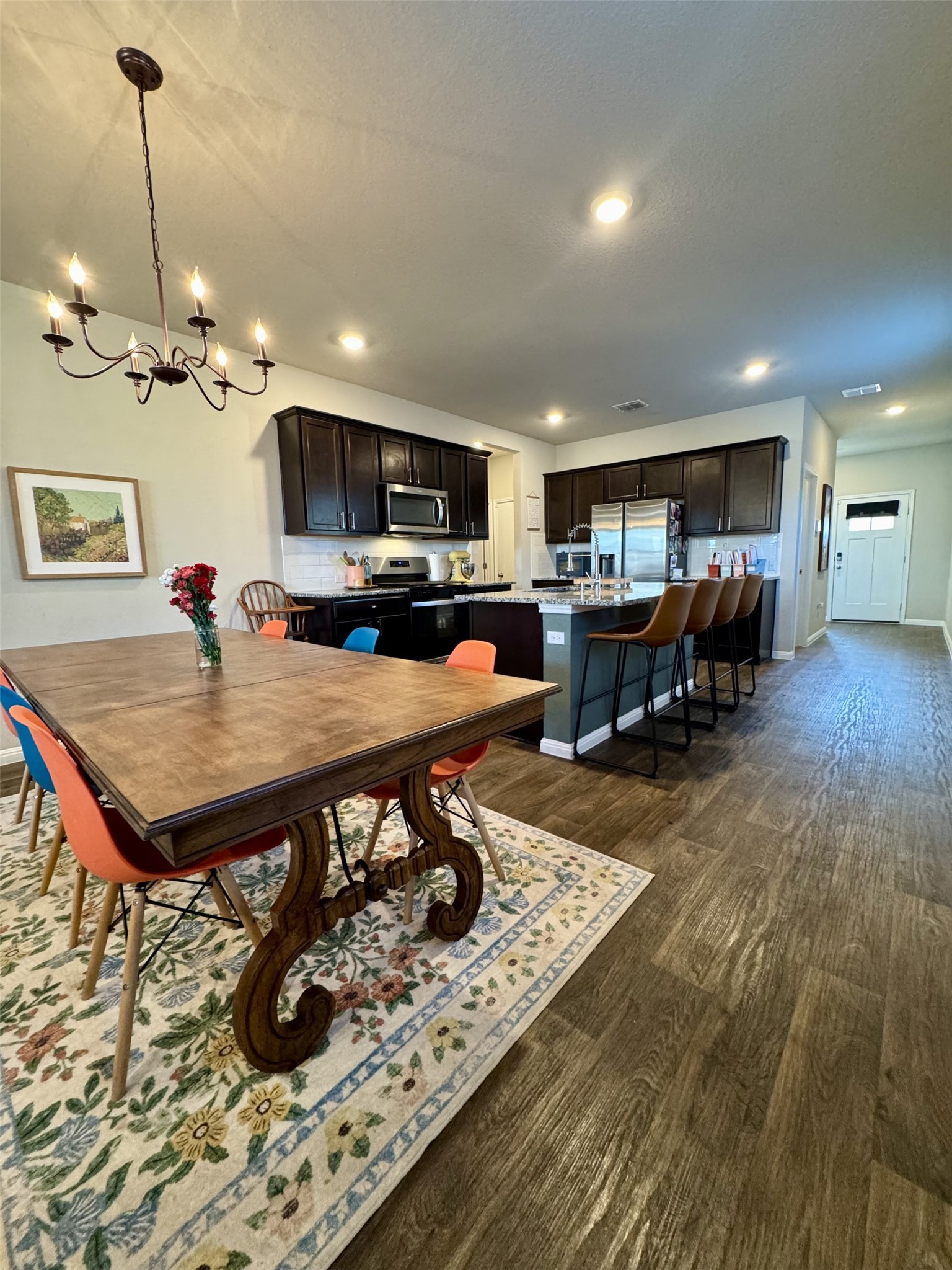 107 Hamilton Pool Lane Bastrop, TX 78602 - Photo 8 of 22 Dining space featuring a chandelier.