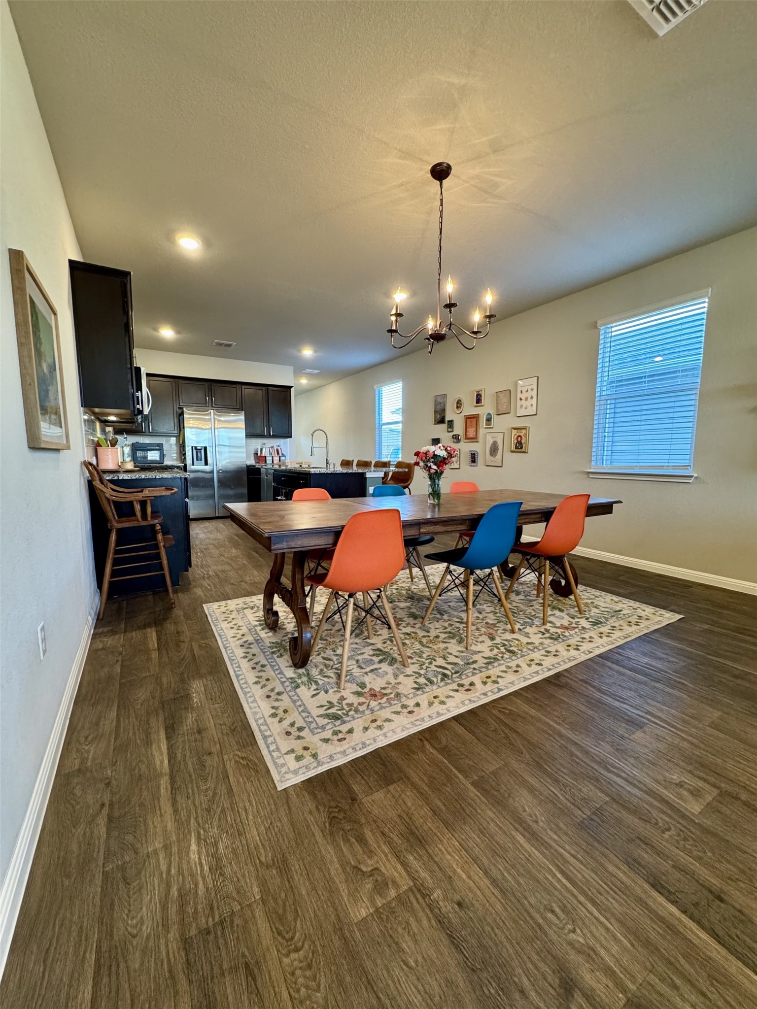 107 Hamilton Pool Lane Bastrop, TX 78602 - Photo 9 of 22 Dining space featuring a chandelier