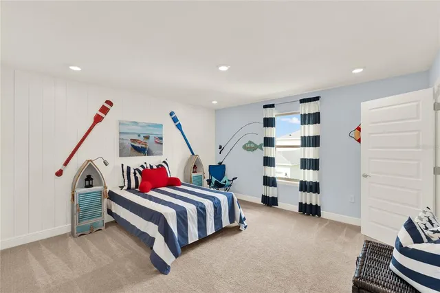 a bedroom with a bed and a large mirror