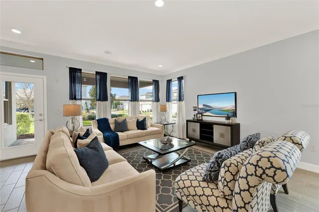 a living room with furniture fireplace and a flat screen tv